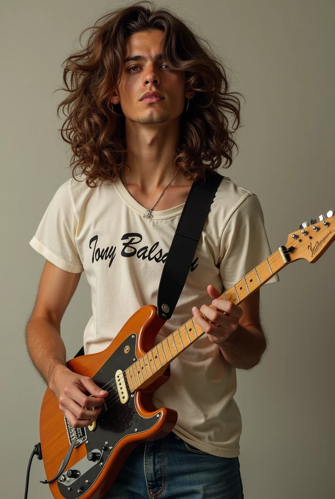 Long curly hair guy with fender guitar wearing a tshirt that writes Tony Balsam on it