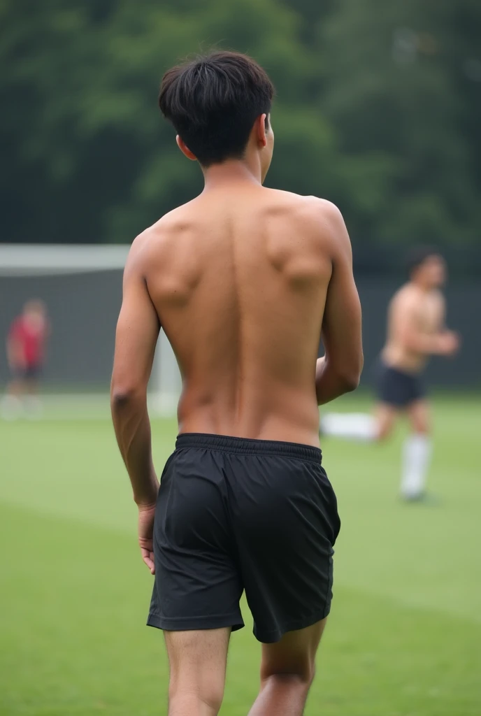 Boy stretching makes his stomach visible to see