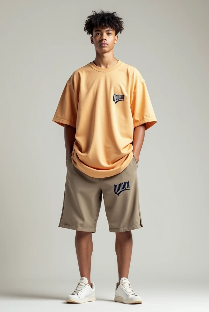 A man wearing oversized t shirt and shorts with brand name is Qunoon with branding on left side of chest and in lest side of short 
