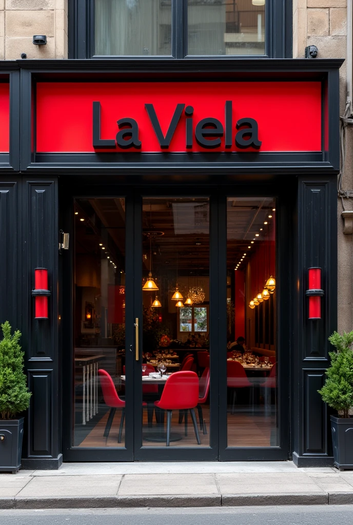 Facade of a restaurant with black and red decor with a glass front and the name is La viela 