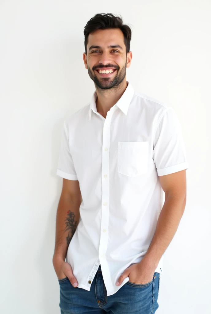 young, slim man, with a little beard on his chin, smiling, white shirt, jeans, white background