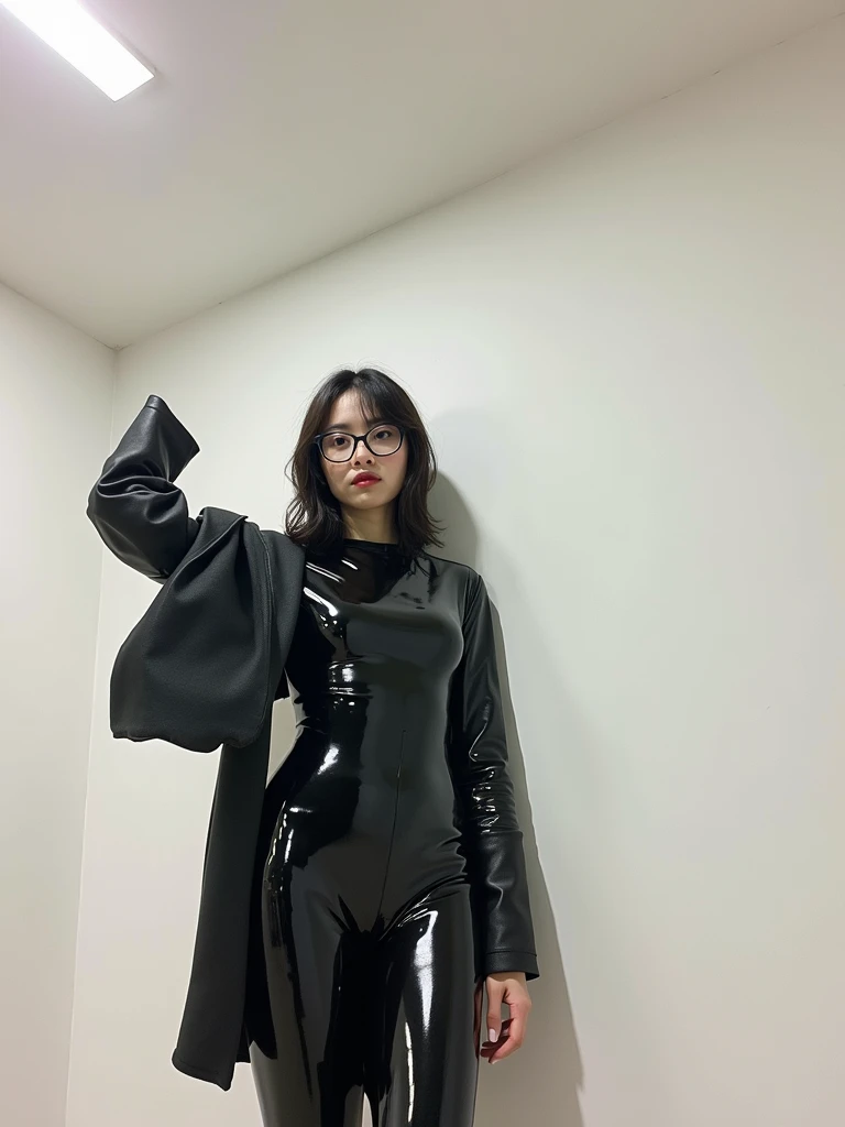 Cute Asian girl wearing glasses, wearing black shiny oiled up latex catsuit