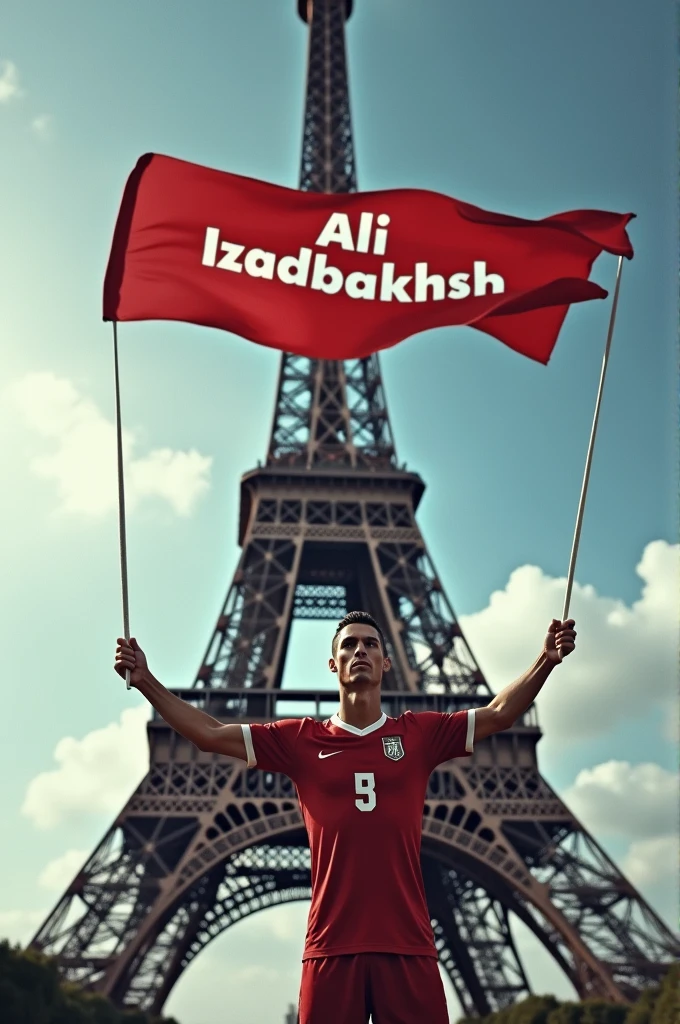  Ronaldo, the soccer player, at the foot of the Eiffel Tower, has a banner in his two hands, &quot;Ali Izadbakhsh&quot;.