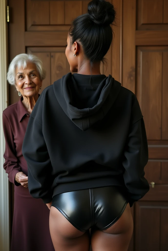 black woman hair in a bun black hoodie black leather short shorts being fucked in the ass by a old grandma in a dress