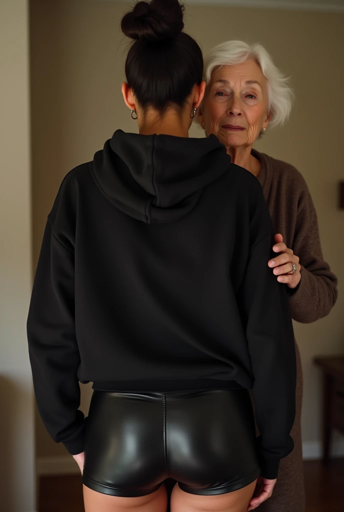 black woman hair in a bun black hoodie black leather short shorts being fucked in the ass by a old grandma in a dress