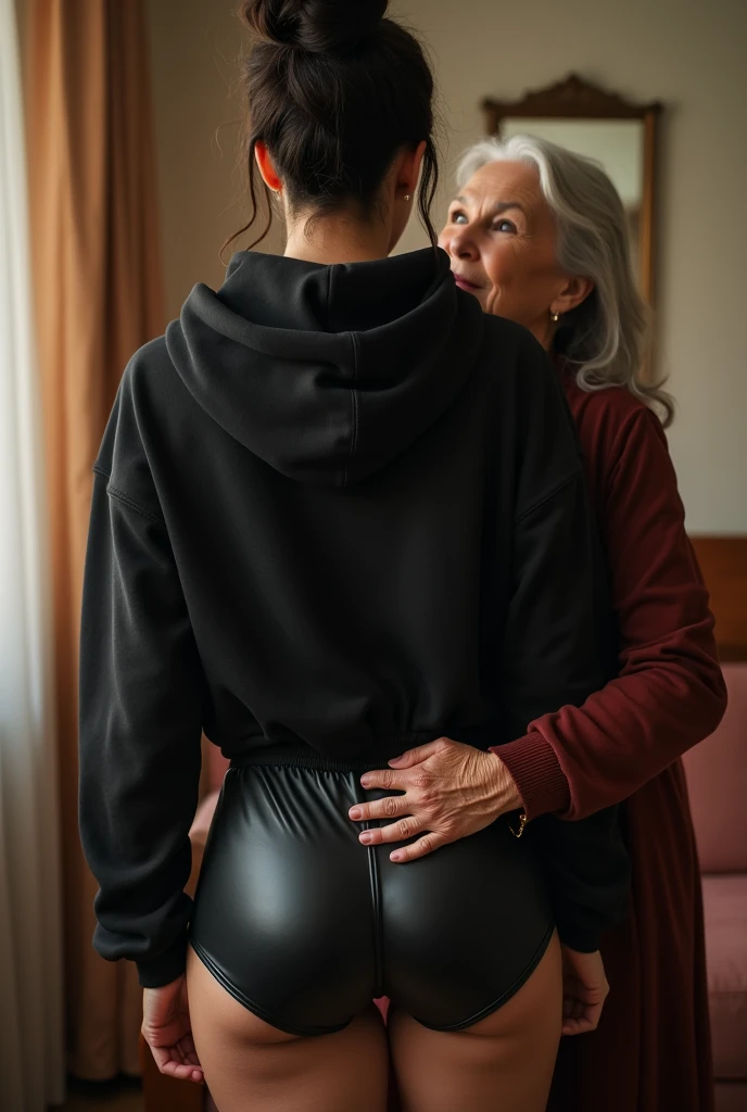 black woman hair in a bun black hoodie black leather short shorts being fucked in the ass by a old grandma in a dress