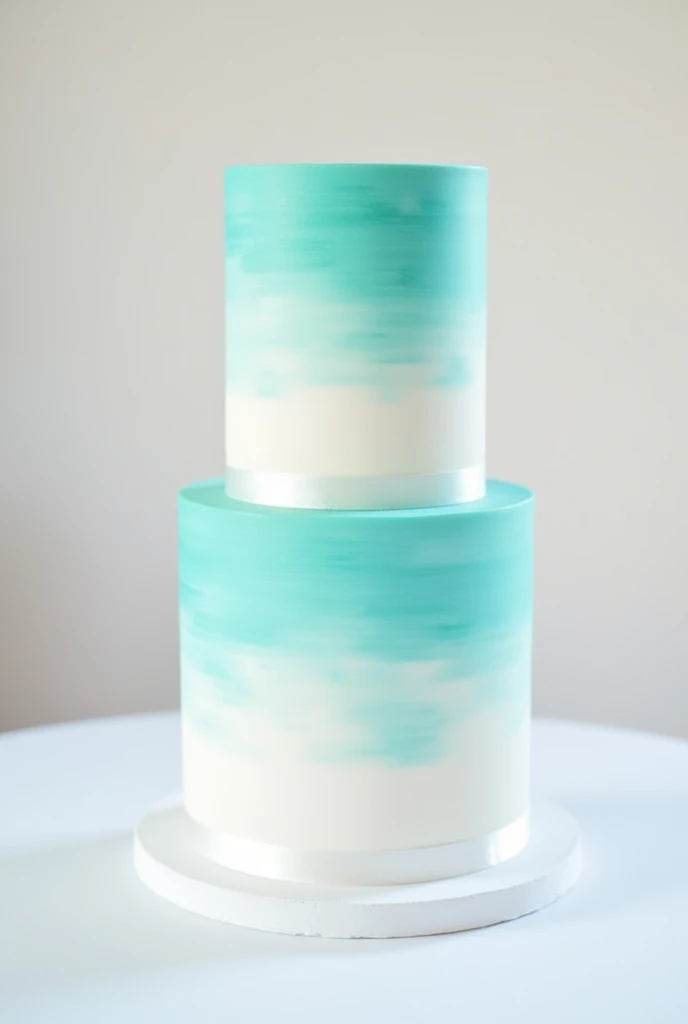 white 2-tier cake brushed with turquoise color on the bases