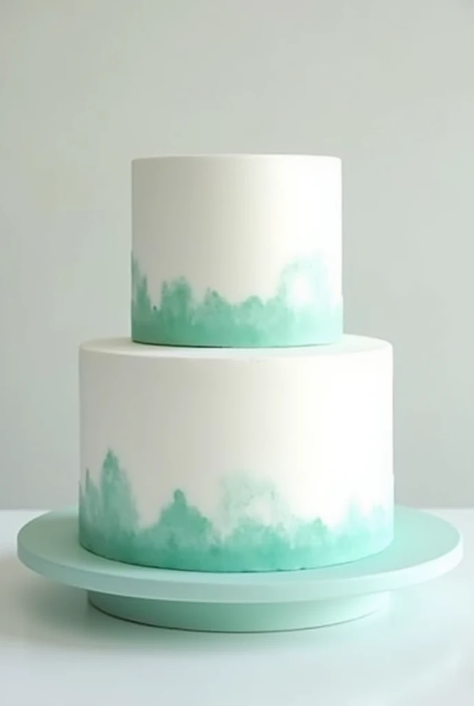 2-tier white cake brushed with turquoise green on the bases