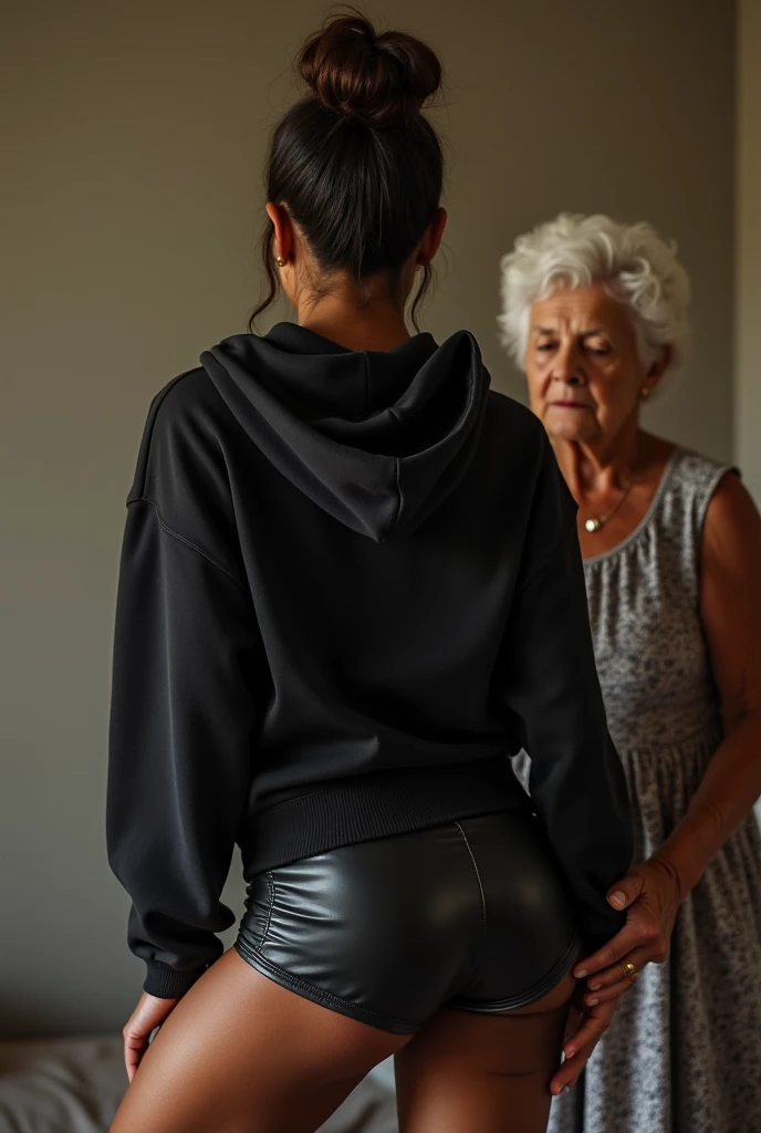 black woman hair in a bun black hoodie black leather short shorts being fucked in the ass by a old grandma in a dress