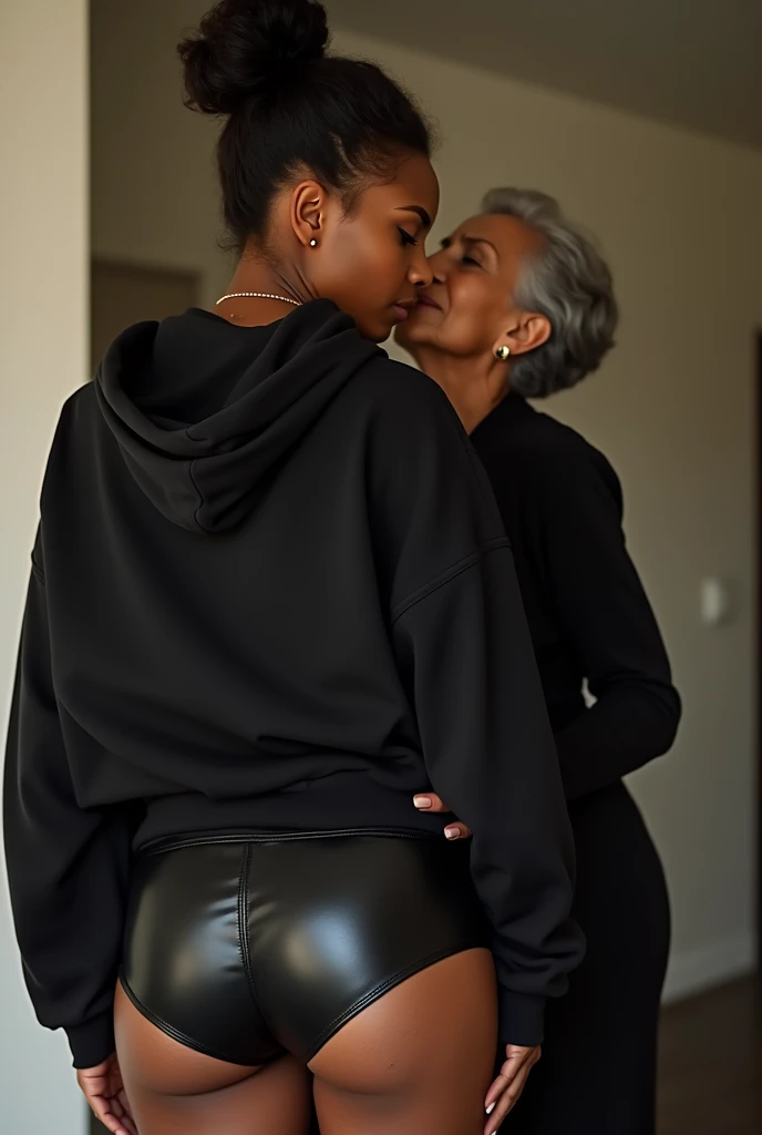 black woman hair in a bun black hoodie black leather short shorts being fucked in the ass by a old grandma in a dress