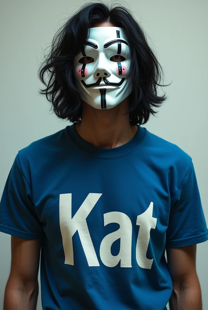 A man with wavy black hair wearing a black mask, a white cross mask, a blue short-sleeved shirt, a KAT-worded screenprinted shirt.