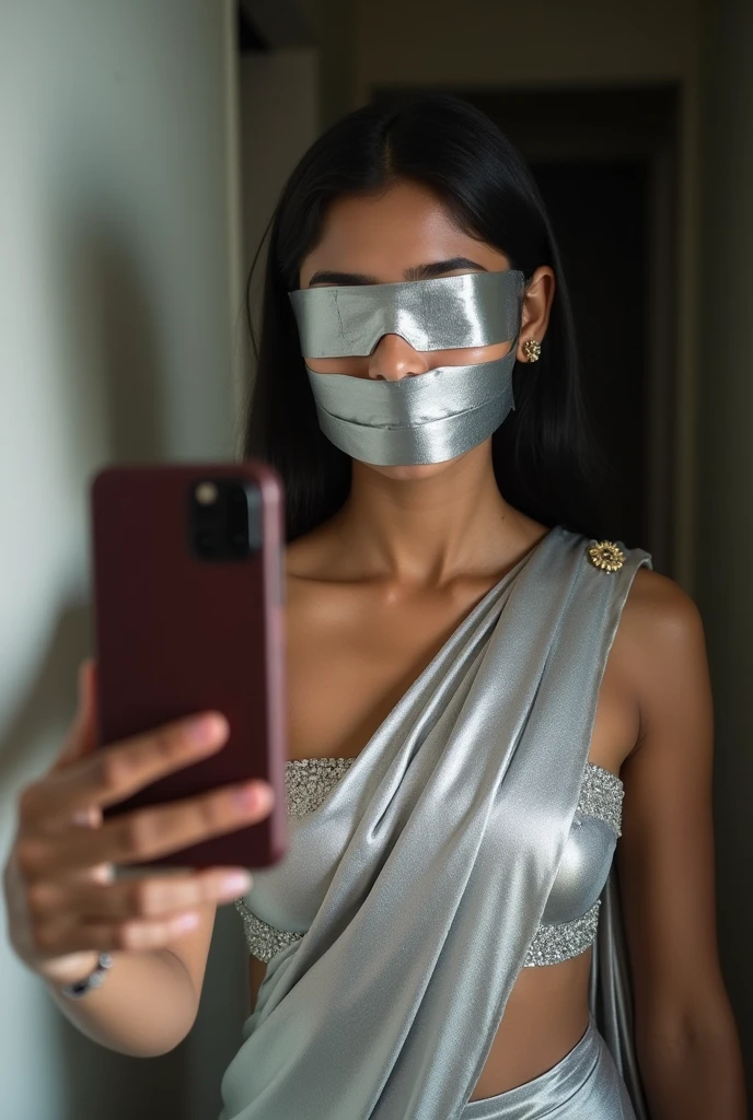 Aesthetic Indian Girl blindfolded Duct tape gagged in sexy silver shimmering prom saree Taking selfie duct tape gagged 