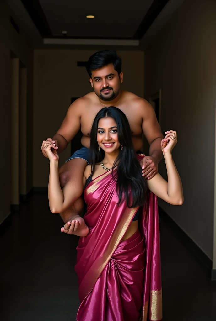 Beautiful and Slim Indian woman in a dark pink silk saree lifting piggyback a large chubby man above her shoulders, man is sitting on woman's shoulders, in a dark room with high ceiling, natural smile, woman is looking into the camera , she is holding his hands, full body image 