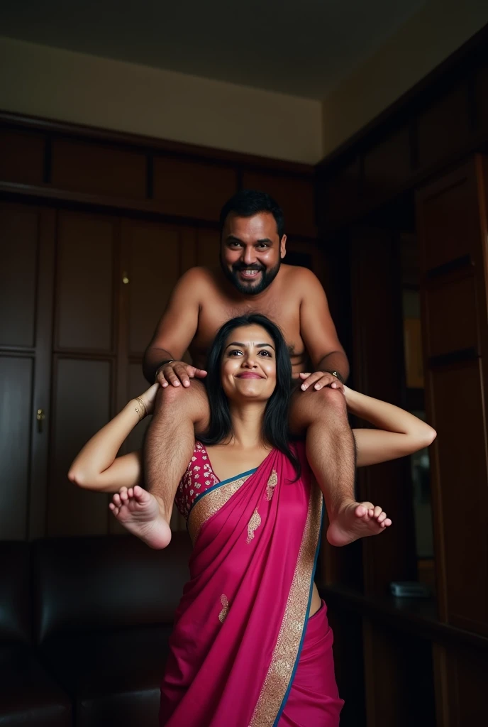 Beautiful and Slim Indian woman in a dark pink silk saree lifting piggyback a large chubby man above her shoulders, man is sitting on woman's shoulders, in a dark room with high ceiling, natural smile, woman is looking into the camera , she is holding his hands, full body image , woman making funny faces