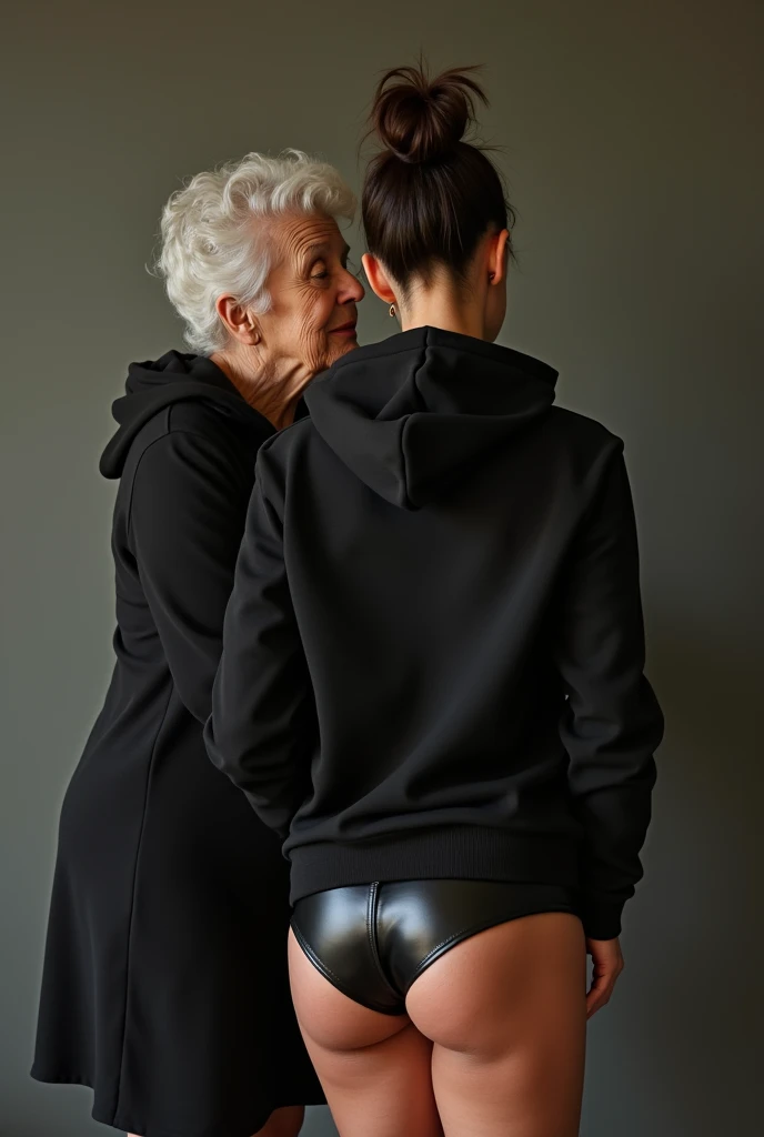 black woman hair in a bun black hoodie black leather short shorts being fucked in the ass by a old grandma in a dress