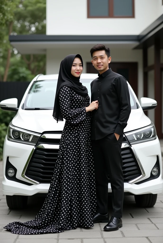 A muslim girl with a black full length polka dress and black hijab and a man with black shirt and black pants standing in front of toyota innova white colour car looking like couples and the background of the car should be a 2 storey house