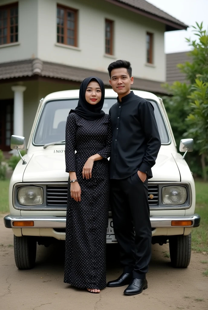 A muslim girl with a black full length polka dress and black hijab and a man with black shirt and black pants standing in front of old toyota innova white colour car looking like couples and the background of the car should be a 2 storey house