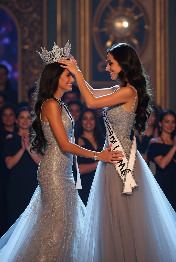 Reigning Miss Universe crowning the new miss Universe. Wear silver long brookat gown. The New Miss Universe is tears when crowning. 