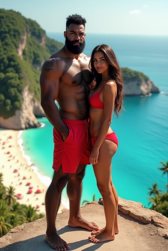 There is a strong, hairy, bearded, very hairy mixed-race man in a red thong posing for a photo standing next to his beautiful girlfriend in a white bikini on a rock at a viewpoint at the end of a paved road with a privileged view just below a large lagoon with brown waters and a white sand beach with many people.