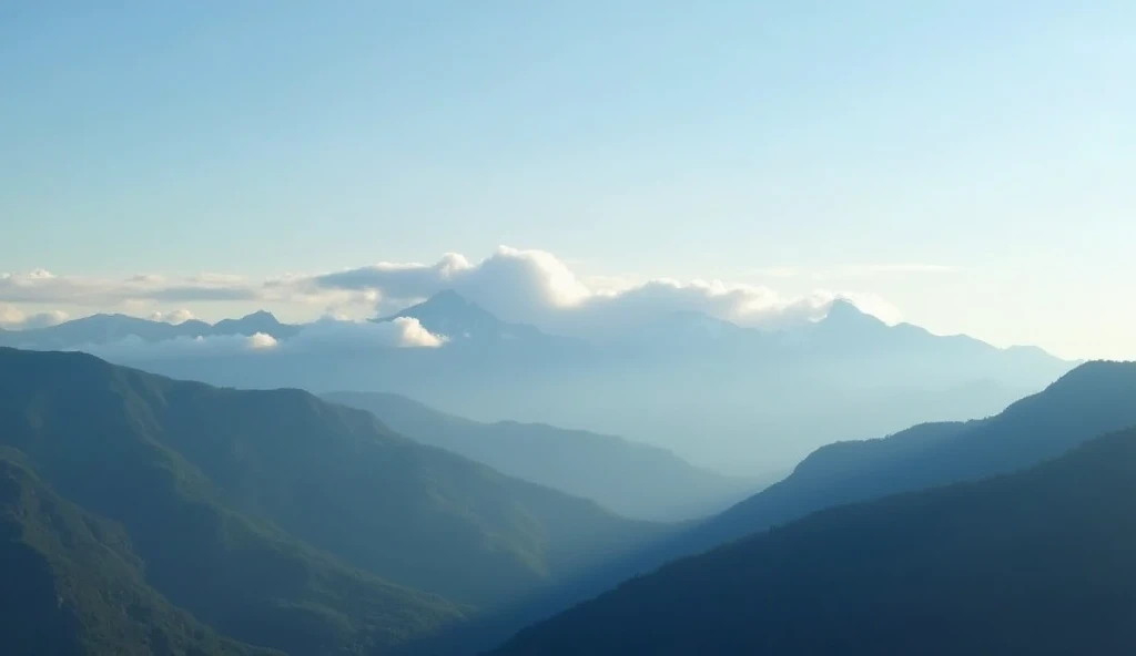 An early morning mountain landscape with very faint clouds hovering above the peaks. The clouds are barely visible against the clear sky, allowing the morning sunlight to highlight the crisp details of the mountains below.