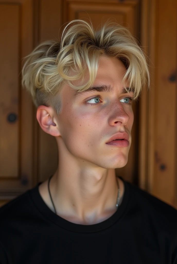 Portrait of a young man with short, messy platinum blonde hair with soft highlights. He has fair skin and a soft expression, looking to the side. His eyes are an intense blue, standing out on his face. The background is a wooden wall that suggests a cozy atmosphere. The young man is wearing a simple black t-shirt. The style of the image is modern and minimalist, with natural lighting that highlights the features of the face. Portrait, with a focus on soft, natural lighting.
