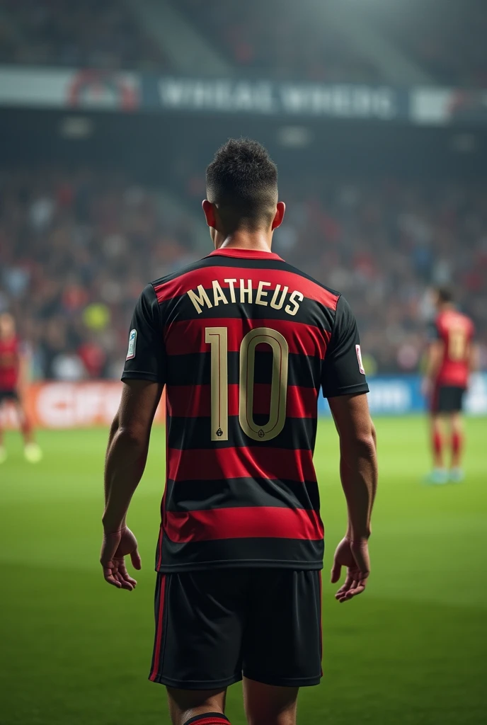soccer player from behind with black and red shirt striped horizontally with number 10 and name matheus