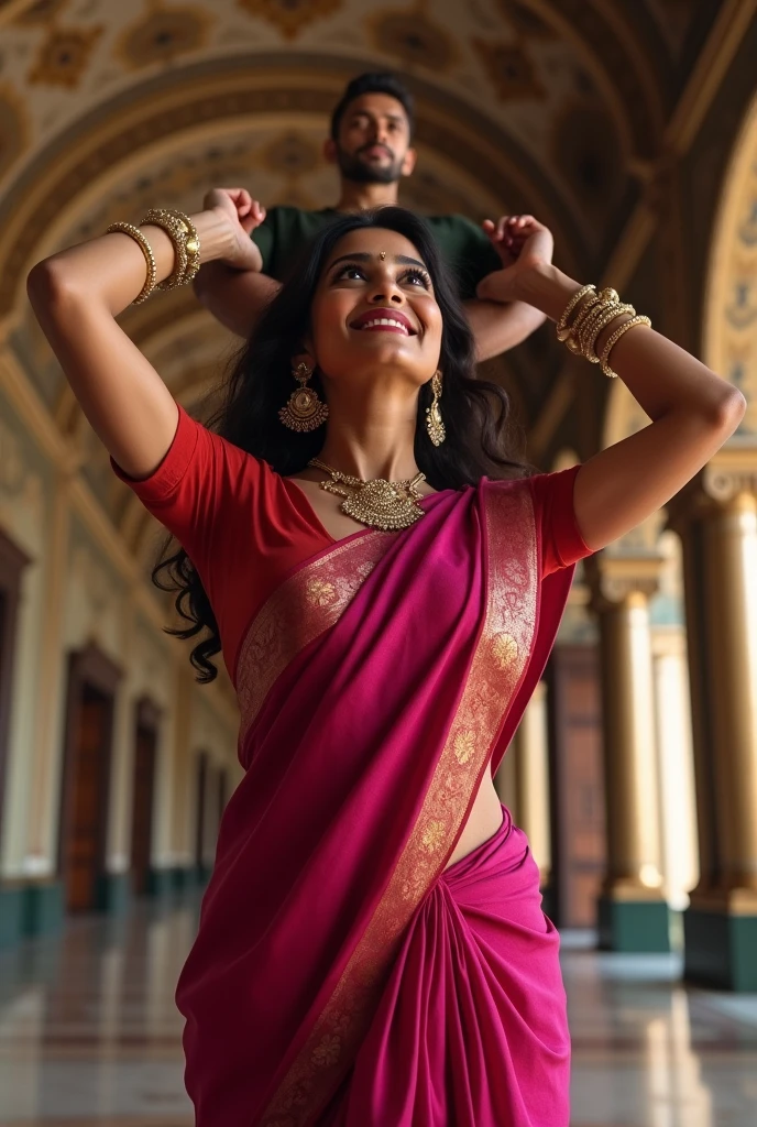 Smiling and Beautiful indian woman in dark pink silk saree lifting up a large man on her shoulders, in a room with high ceiling, full body view