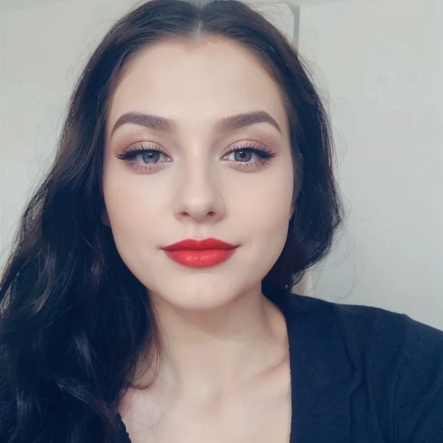 There is a woman with long hair and red lipstick, gorgeous attractive face, beautiful and attractive face, face with full makeup,