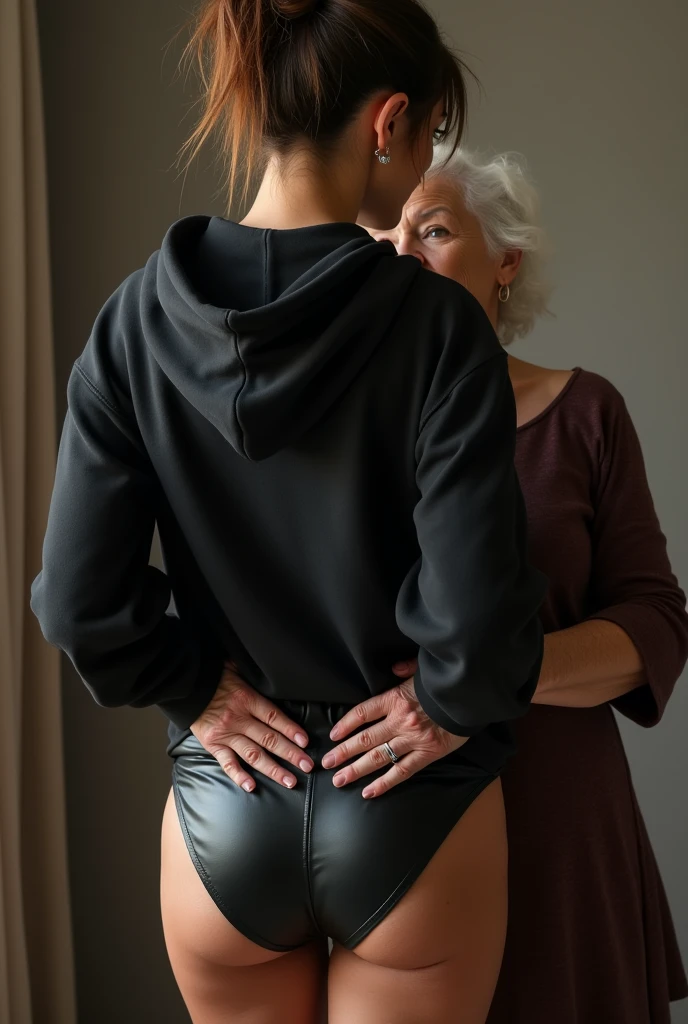 black woman hair in a bun black hoodie black leather short shorts being fucked in the ass by a old grandma in a dress