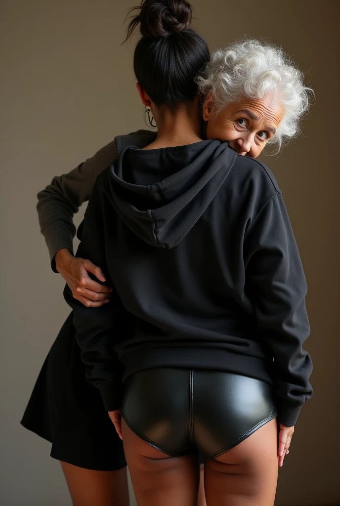 black woman hair in a bun black hoodie black leather short shorts being fucked in the ass by a old grandma in a dress
