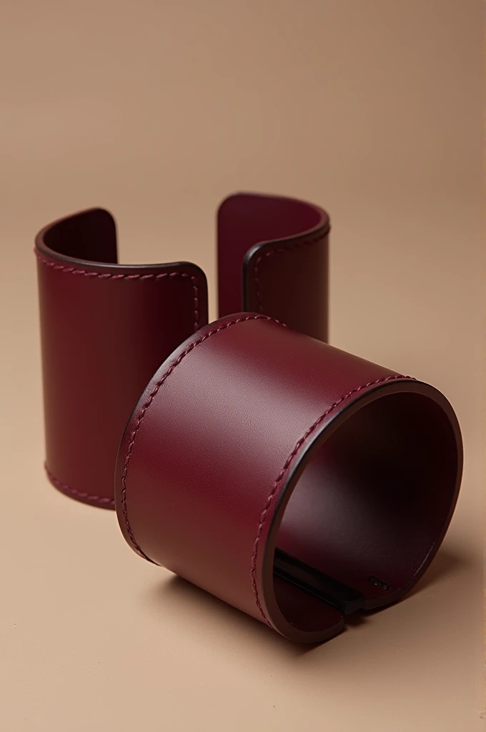 Make a catalog photo of maroon colored cuffs