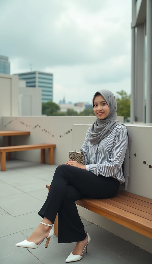A Potrait Mode young woman wearing a hijab and a striped long-sleeved blouse, sitting on a wooden bench at an outdoor terrace with modern architecture. She has black pants and white high-heeled sandals. She is holding a small patterned bag on her lap and looks relaxed. The terrace is surrounded by a light-colored wall with geometric cutouts, and there are tables and benches around. In the background, there are modern buildings with a minimalistic design and a cloudy sky above. The scene has a calm and serene atmosphere. Detail Realistic With Photografy Style Of Vivid 8K Resolations