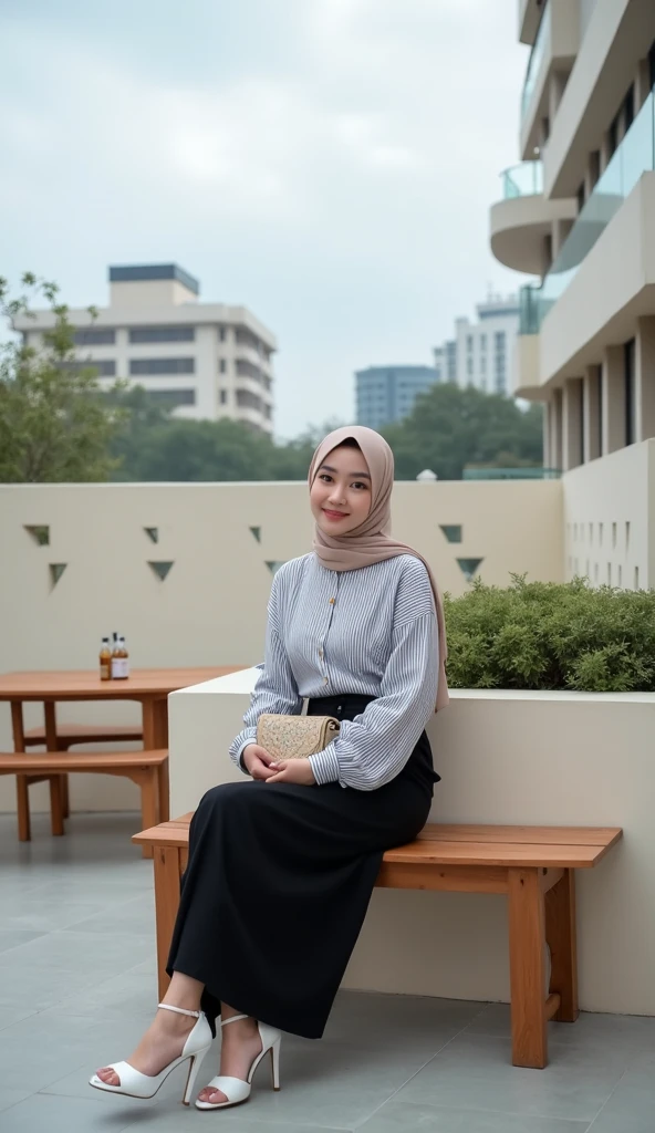 A Potrait Mode young woman wearing a hijab and a striped long-sleeved blouse, sitting on a wooden bench at an outdoor terrace with modern architecture. She has black pants and white high-heeled sandals. She is holding a small patterned bag on her lap and looks relaxed. The terrace is surrounded by a light-colored wall with geometric cutouts, and there are tables and benches around. In the background, there are modern buildings with a minimalistic design and a cloudy sky above. The scene has a calm and serene atmosphere. Detail Realistic With Photografy Style Of Vivid 8K Resolations