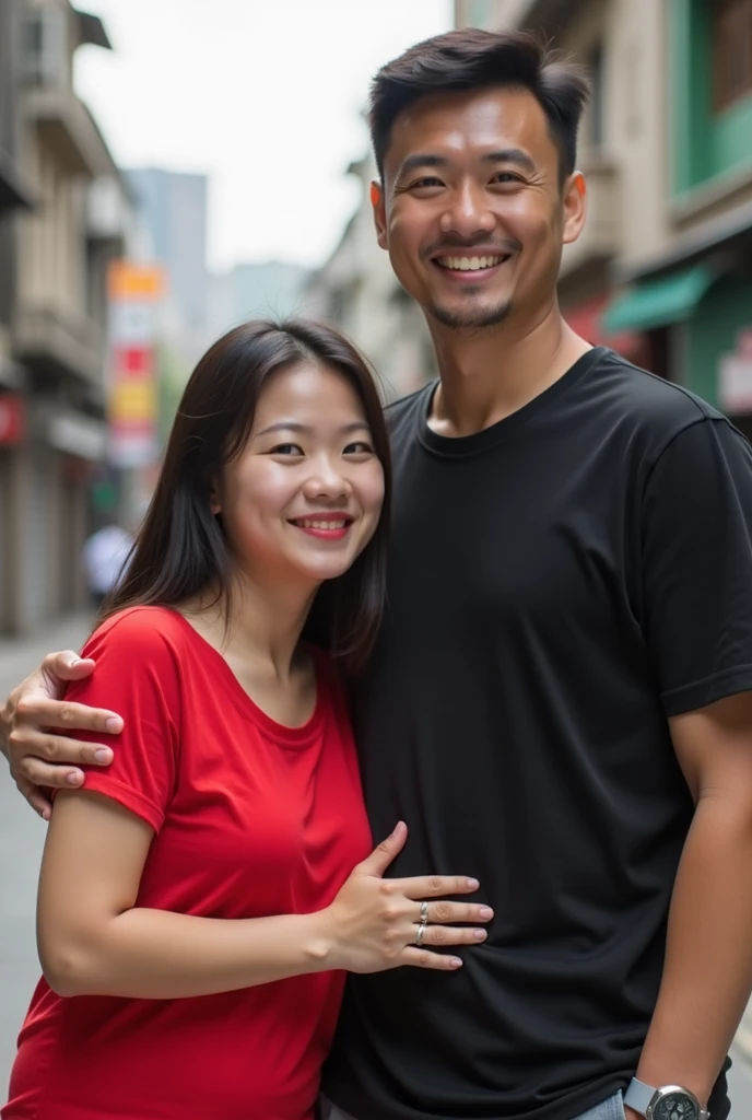 Chinese beautiful girl 23 years-old couple with an Indonesian man 40 years-old, 23 years-old girl as wife, 40 years-old man as her husband, the girl hug the man, the girl wearing red T-shirt, the girl red lips, the man wearing black T-shirt, the girl with the man stands in street city building, curvy body, thick body, little bit fat.