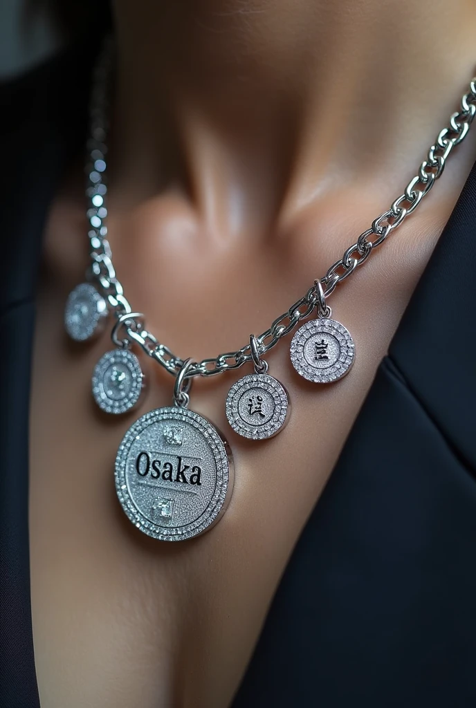 Silver chain set with diamonds with the text "Osaka" as medals written to resemble Japanese writing all in diamonds