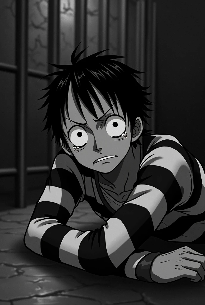 Monkey D. Luffy in a black and white striped long sleeve prison uniform with teary eyes inside a jail lying on the floor