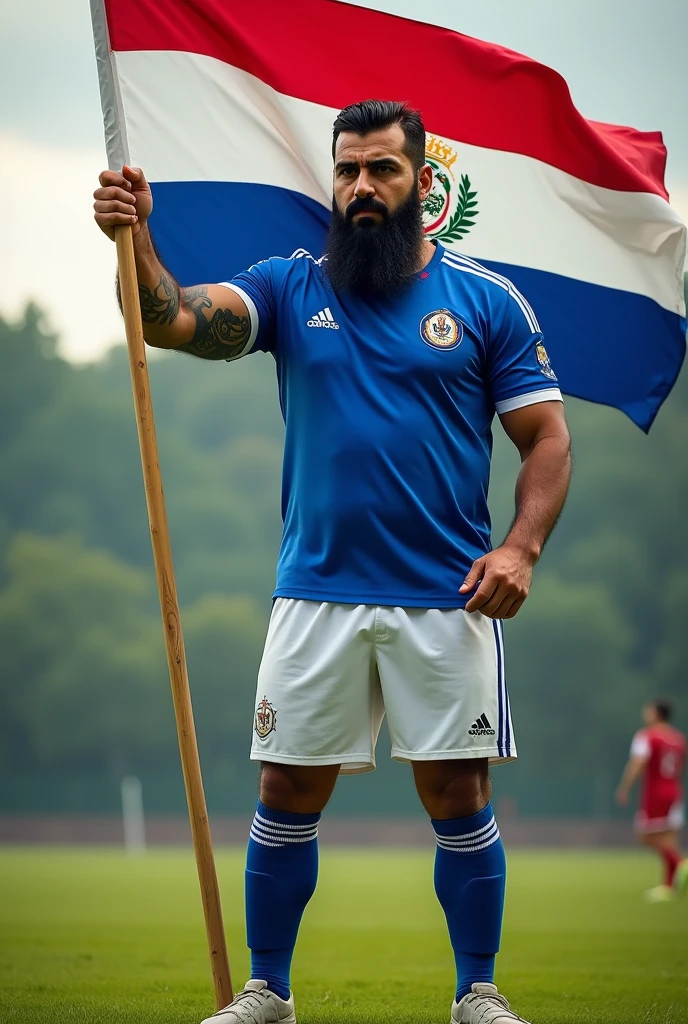 A very bearded hairy strong Persian man wearing the El Salvador national football team uniform. He must wear a blue shirt with white details and the Salvadoran Football Federation shield on the chest.. The shorts must be white with blue details., and the socks, blue with a white stripe. His expression should be confident, e a pose, Stately, reflecting their strength and pride by wearing the uniform, waving the Nicaraguan flag in the field.