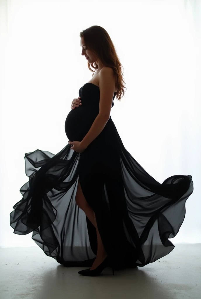 Pregnant woman in black dress half-naked artistic photo in daylight with white background 
