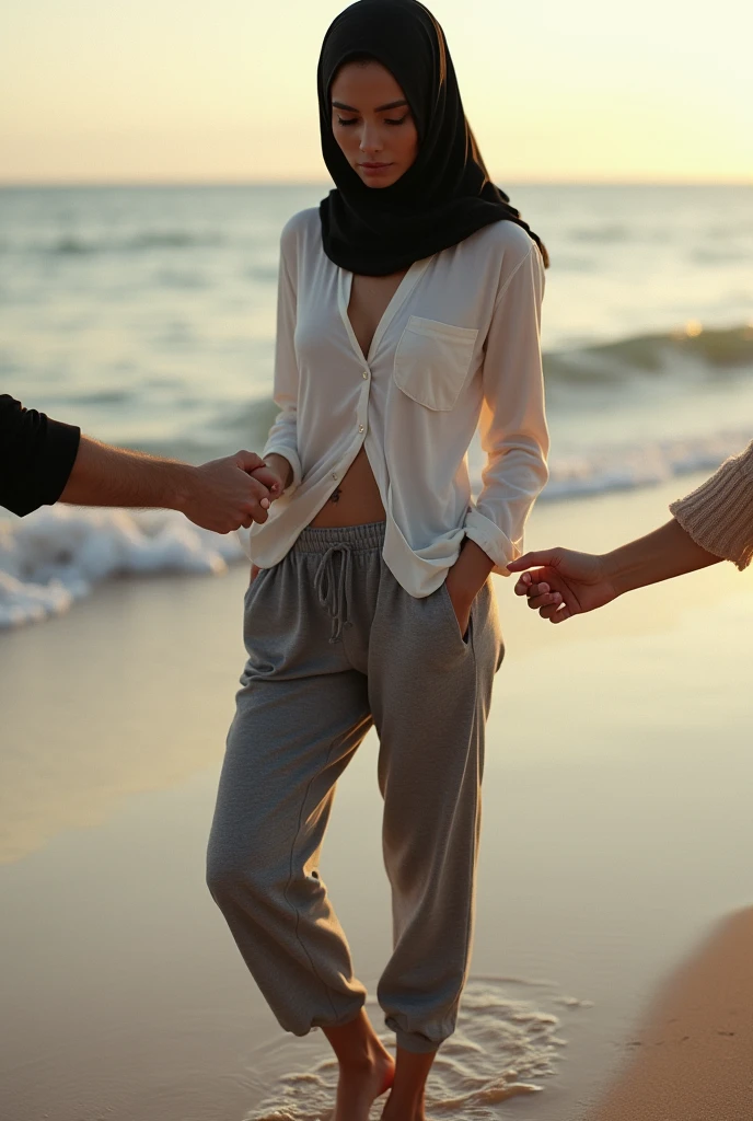 Black headscarf on the beach, white long sleeve t shirt, barefoot, grey sweatpants, skinny sexy woman. People touching a woman&#39;s waist. 