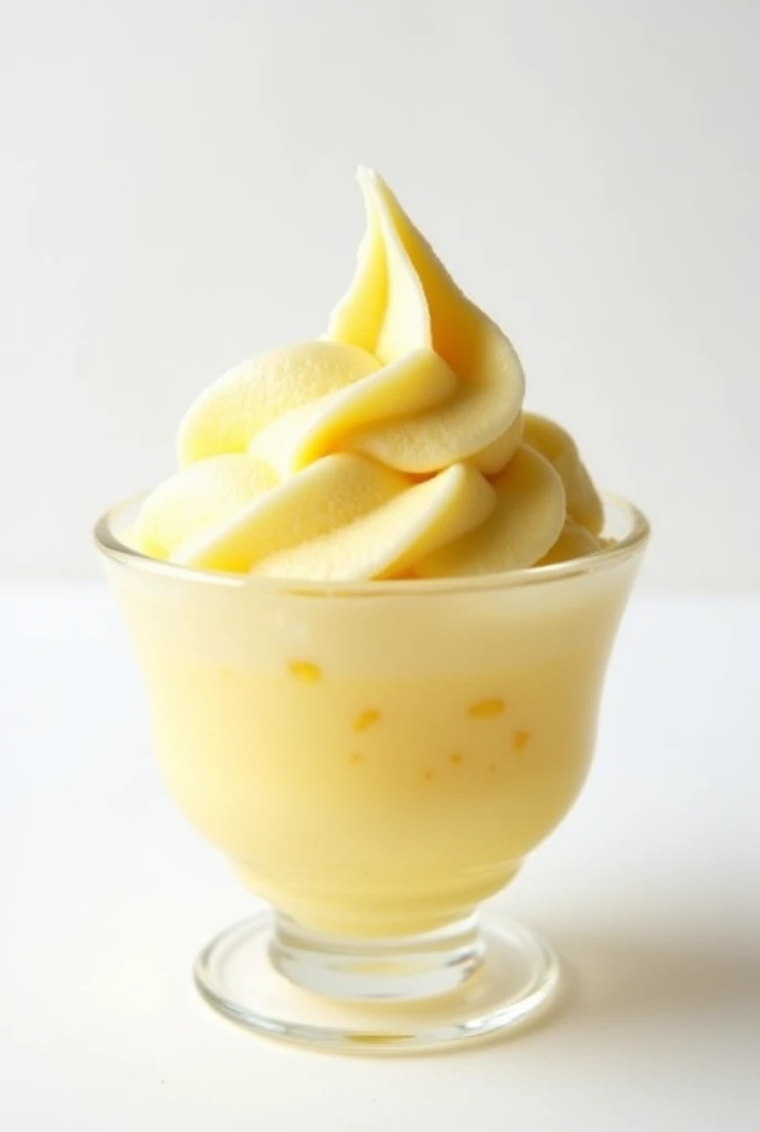 A creamy pineapple-flavored ice cream in a glass cup with a white background and shadows