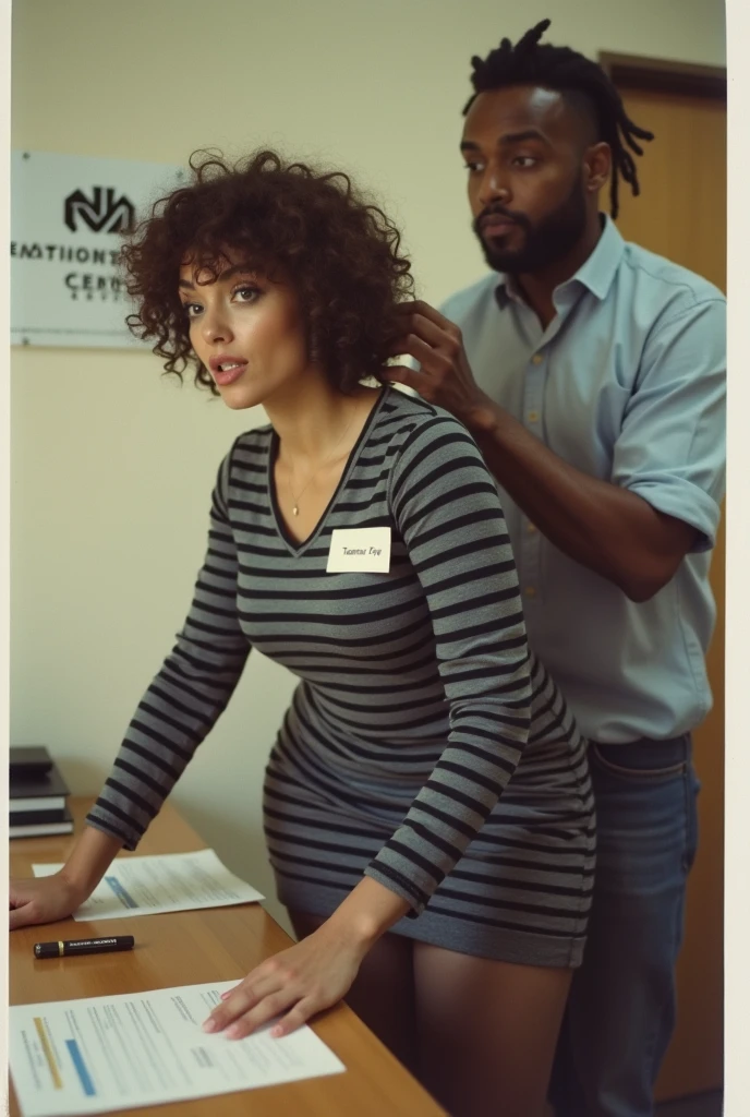 photo taken with a 1980s disposable camera, a 35-year old short curly hair woman, slighty chubby with very medium breasts, wide hips, , pronounced clavicles, plump ass, with short curly brown hair, blue eyes , plump juicy wet lips, high defined cheekbones, soft elegant jawline, she's wearing a tight cotton dress that goes down mid-thigh with broad thick horizontal black and gray stripes and long sleeves. Her dress is hiked up to the top of her thigh, messily, so you can see her entire pantyhose to her waist. She has on dark black sheer pantyhose under her dress and very long legs. A sign with the logo for "Nashville Entrepreneur Center" is on the wall. She is standing, bent over a table, facing the camera, look at some paperwork. Very important that she is standing and bent over. A handsome professional dreadlocked black man is standing behind her, touching her breast as she is bent over the table. She is looking directly at the camera with a surprised but satisfied look on her face as the dreadlocked black man stands directly behind her bent over the table. Her mouth is agape widely. She has a name tag that says "Tamara Fyke". Important that she has sagging breasts. No large breasts. Very bright and harsh camera flash, like a paparazzi flash, as if they were caught having an affair. bad lighting, candid boring blurry low quality analog polaroid photo. ultra-detailed photorealism. they both have surprised expressions on their faces.