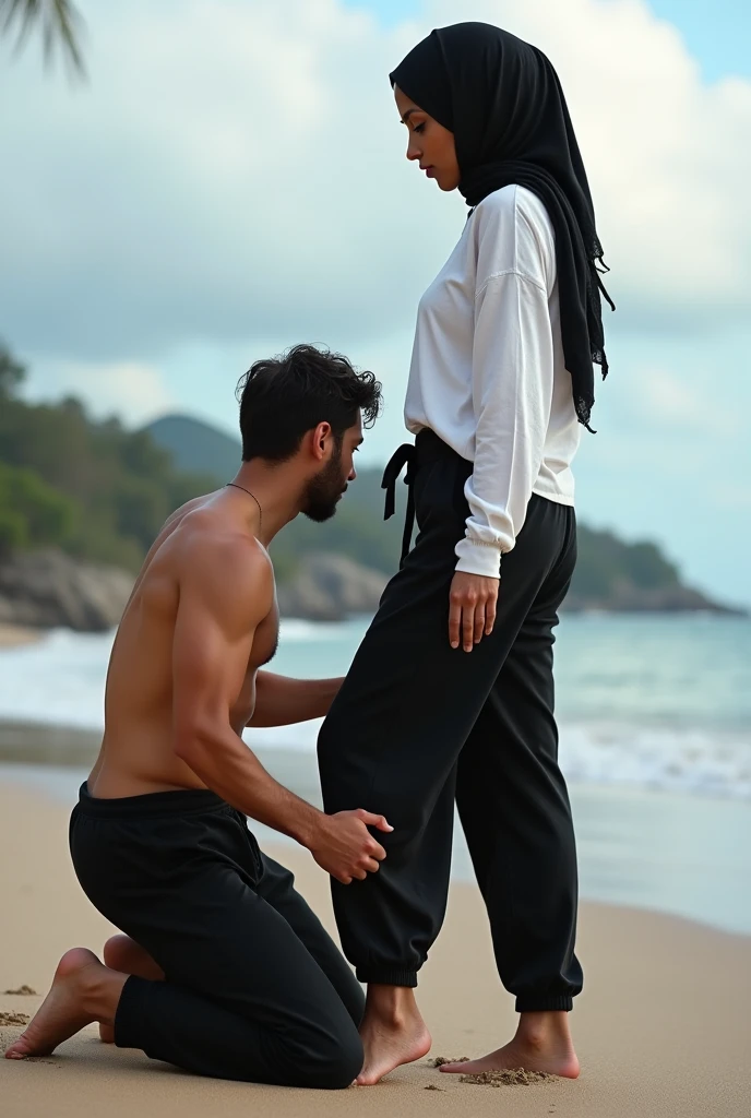 Black headscarf on the beach, white long sleeve t shirt, baggy black sweatpants, barefoot, Sexy skinny woman. Man kneeling in front of woman, Woman touching the front of man's sweatpants with her foot.