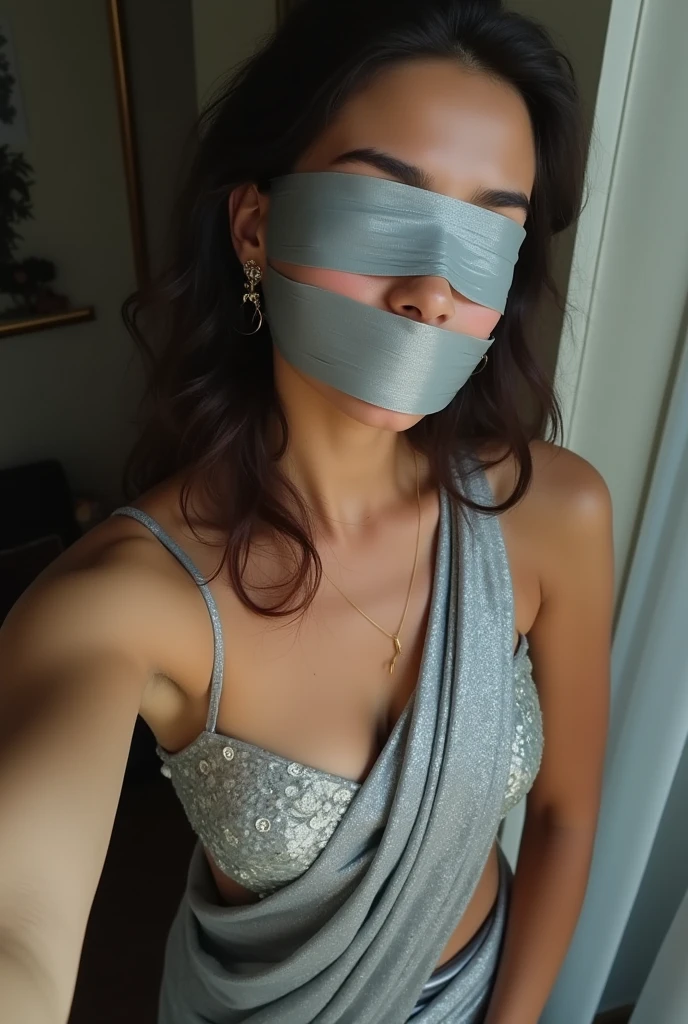 Aesthetic Girl blindfolded Duct tape gagged in sexy silver shimmering saree Taking selfie duct tape gagged