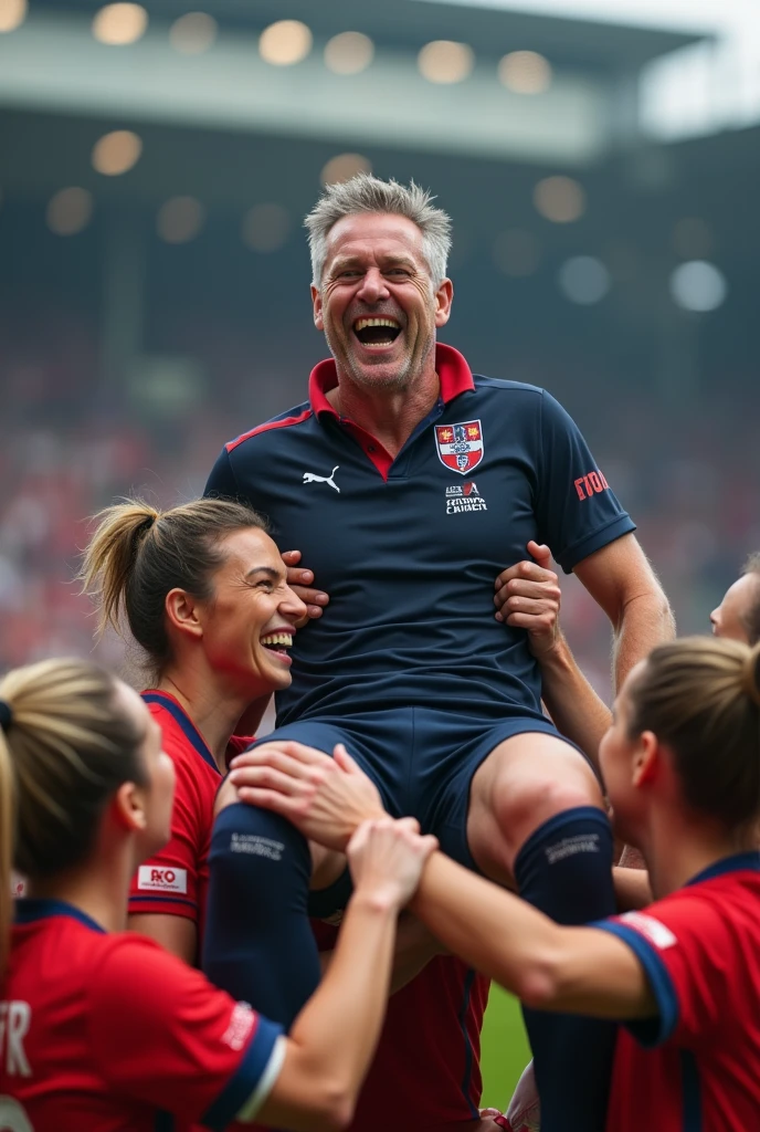 A british womans football match where the woman are carrying their male manager in celebration he is in his early 40s