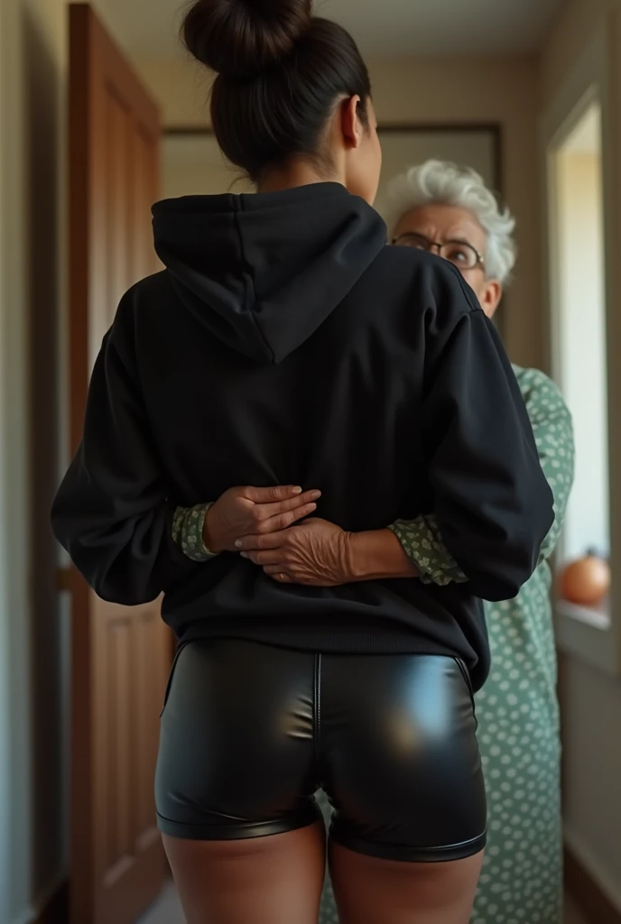 black woman hair in a bun black hoodie black leather short shorts being fucked in the ass by a old grandma in a dress