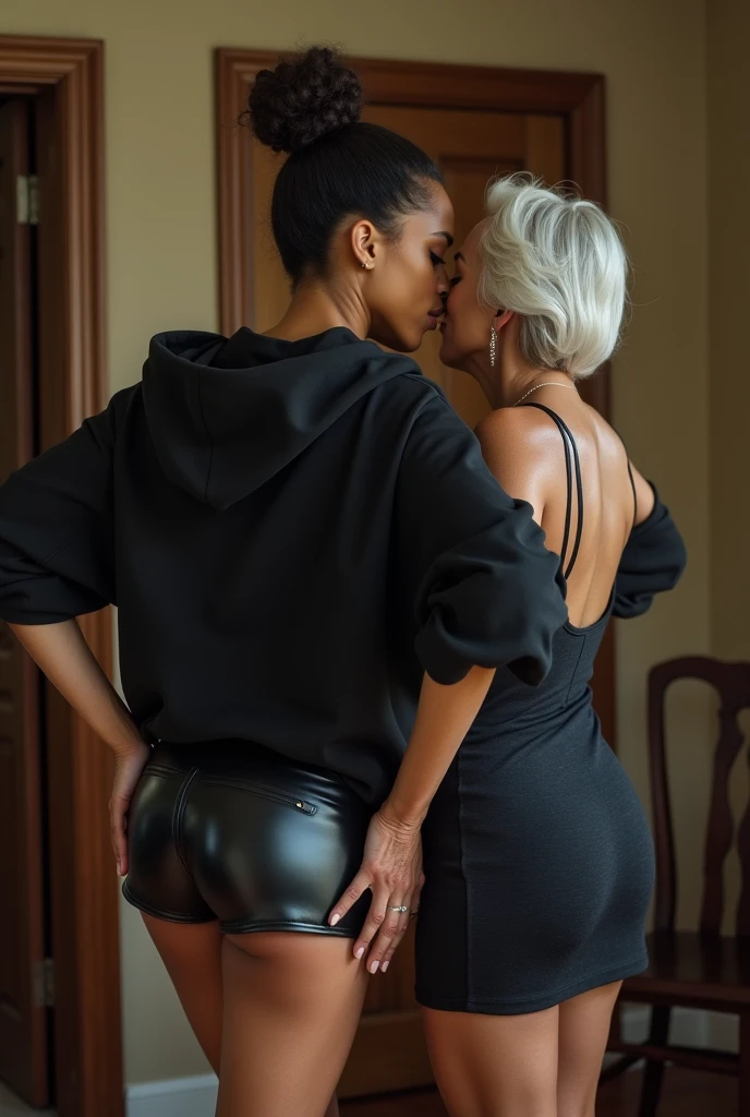 black woman hair in a bun black hoodie black leather short shorts getting fucked in the ass by a old age white grandma in a dress in a living room