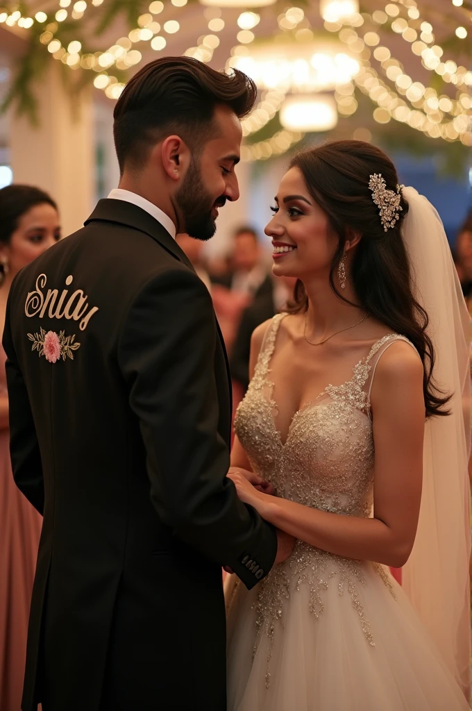 A new couple which meet first time on his marriage. Boy wearing a pant coat name Khizar written on it and Girl wearing a bridal Dress name Sonia written on it  