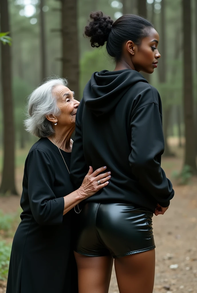 black woman hair in a bun black hoodie black leather short shorts being fucked in the ass by a old grandma in a dress