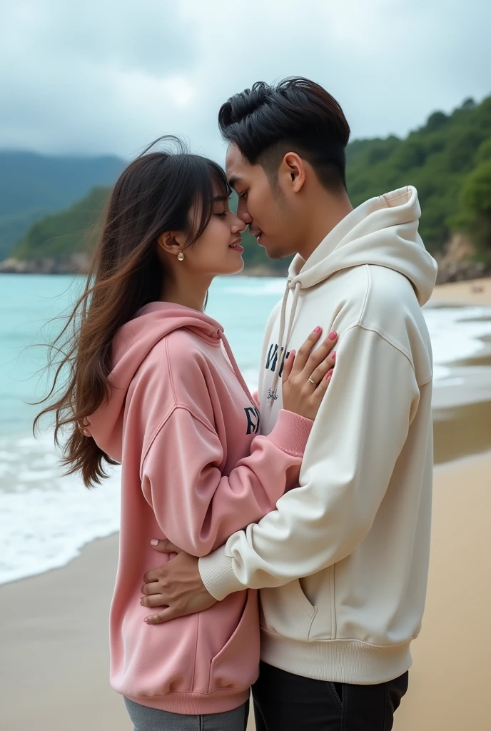 A very beautiful Indonesian woman with long hair and bangs wearing a pink hoodie with Chania written on it is hugging a handsome Indonesian man with neat hair wearing a thick white hoodie with Epy written on it. On the edge of a beautiful beach, full body realpict photo. Looks very real, realpict