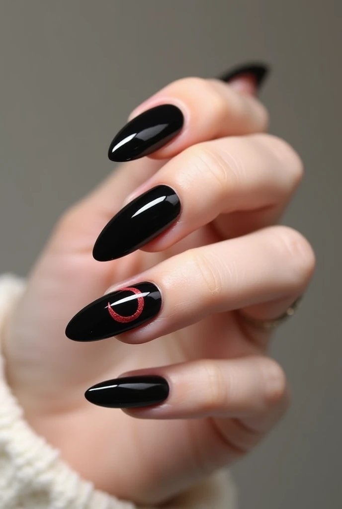 Black almond soft gel nails with simple drawings of a moon on one finger, in red